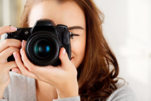Woman taking a picture with a dslr camera